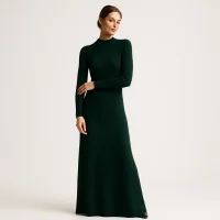 Female model wearing dark green long knit dress, premium knitwear